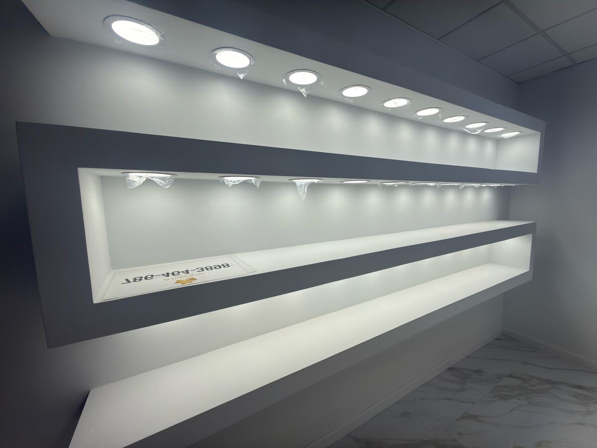 Custom lit display shelving and cabinetry