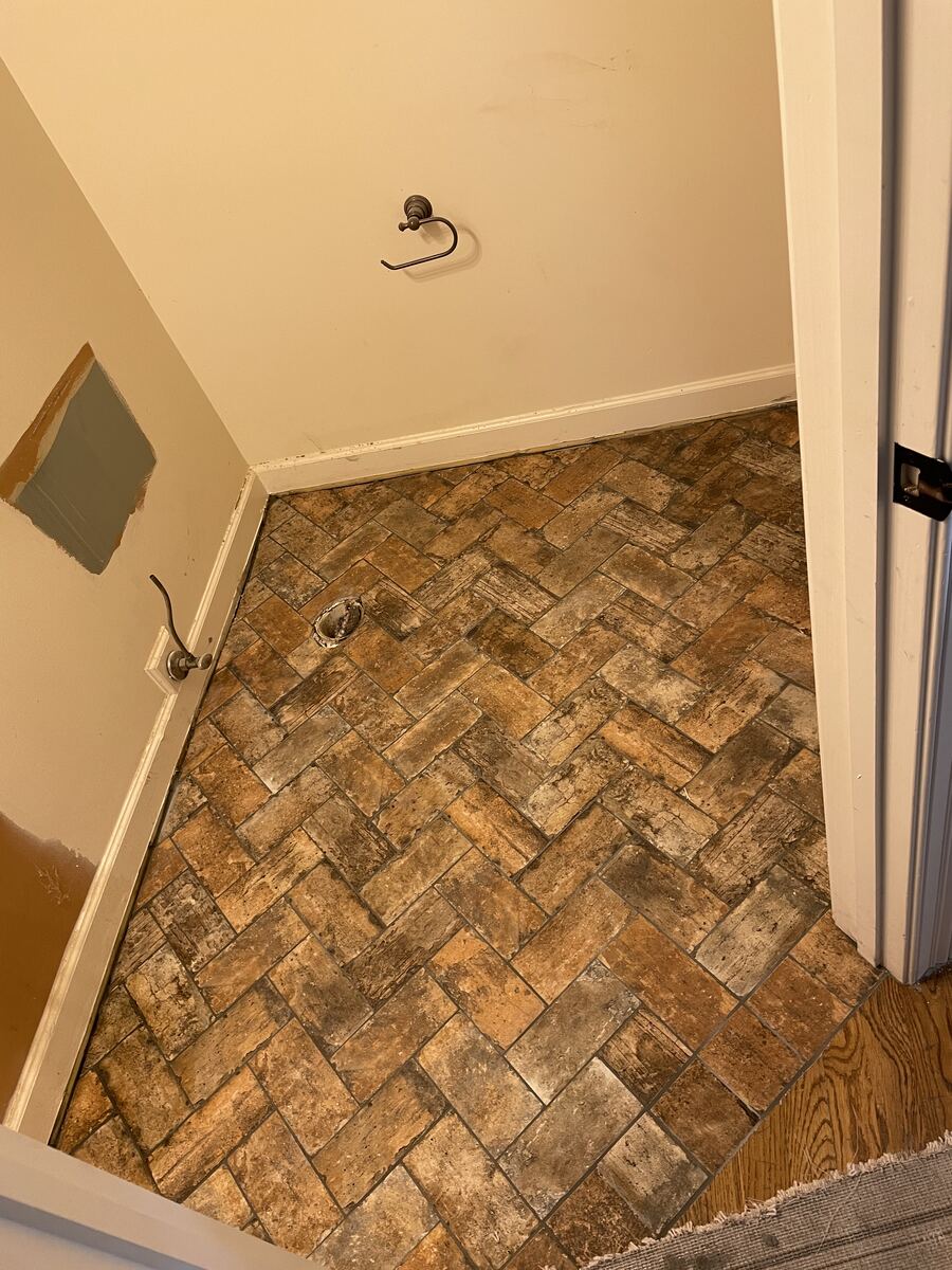 Herringbone brick-look tile floor