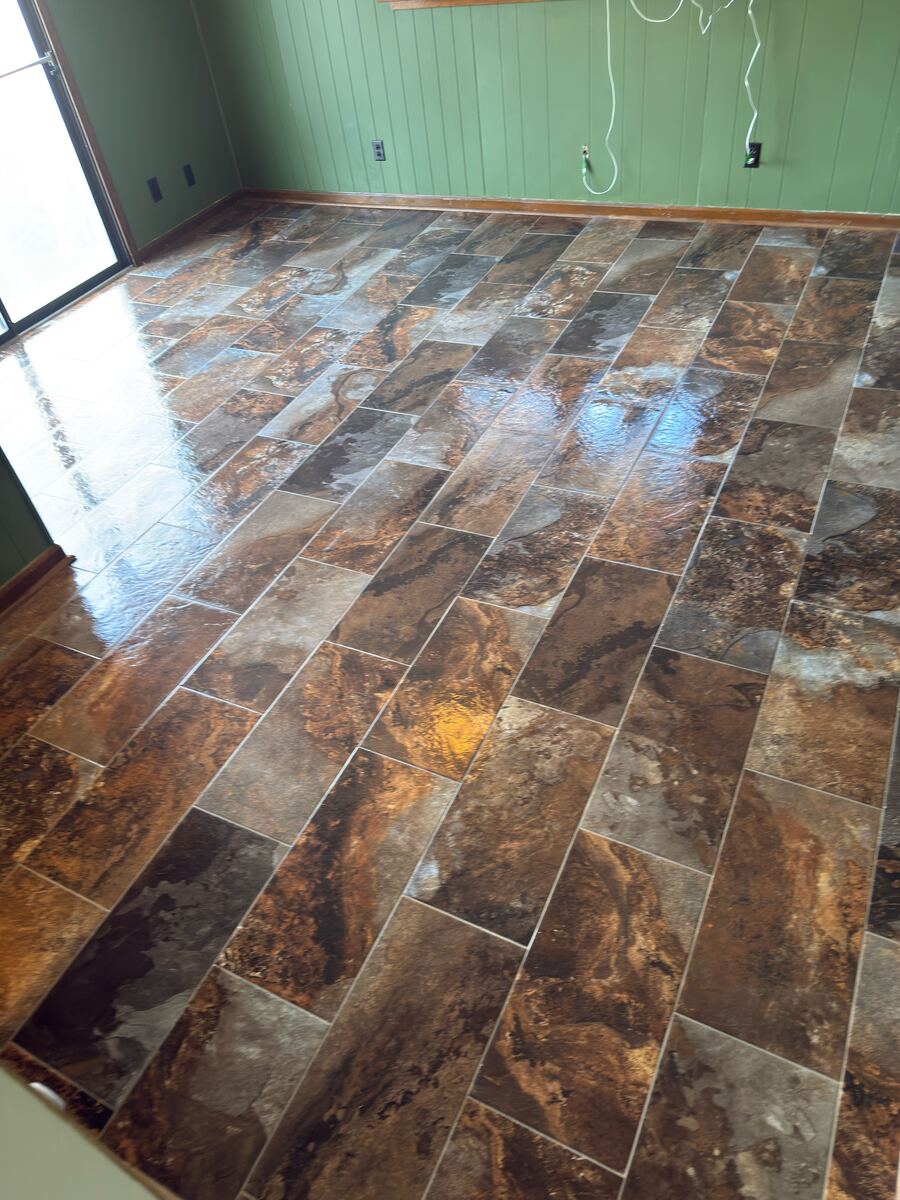 Stone-look tile flooring with warm tones