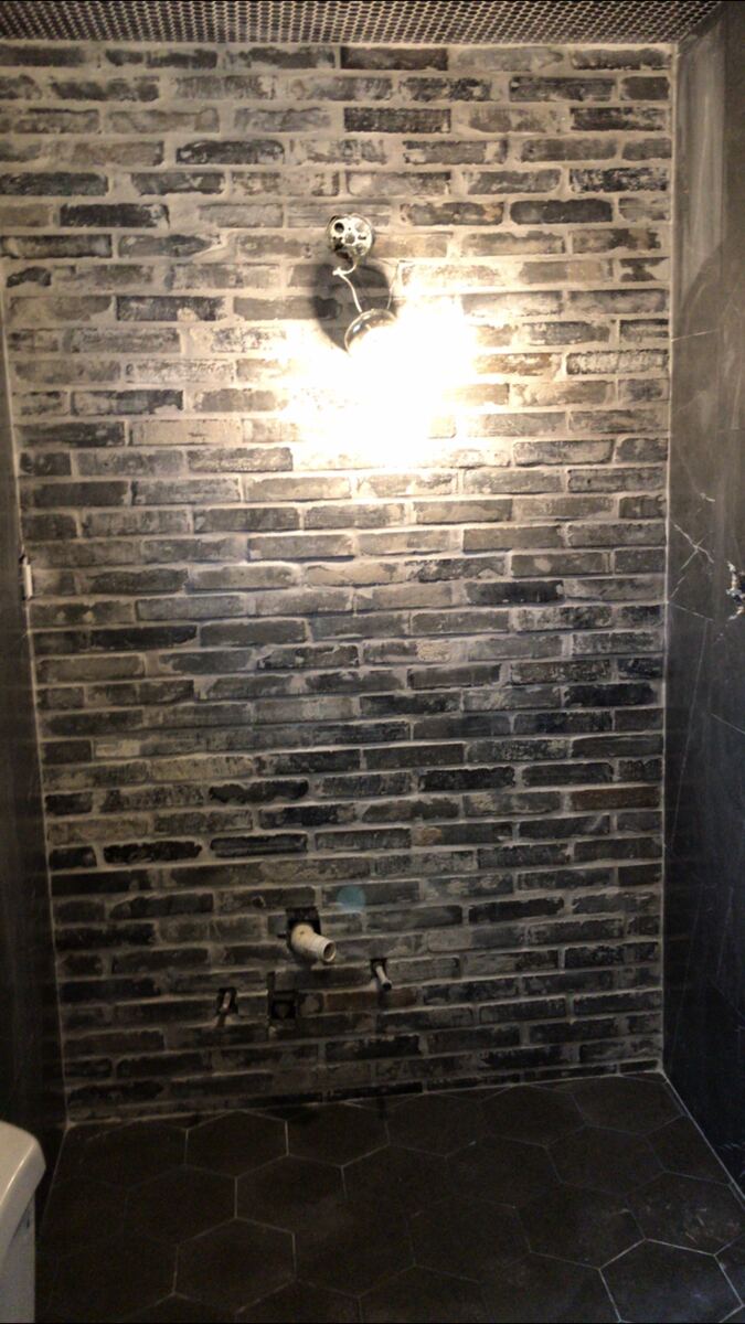 Brick-style tile shower wall in progress