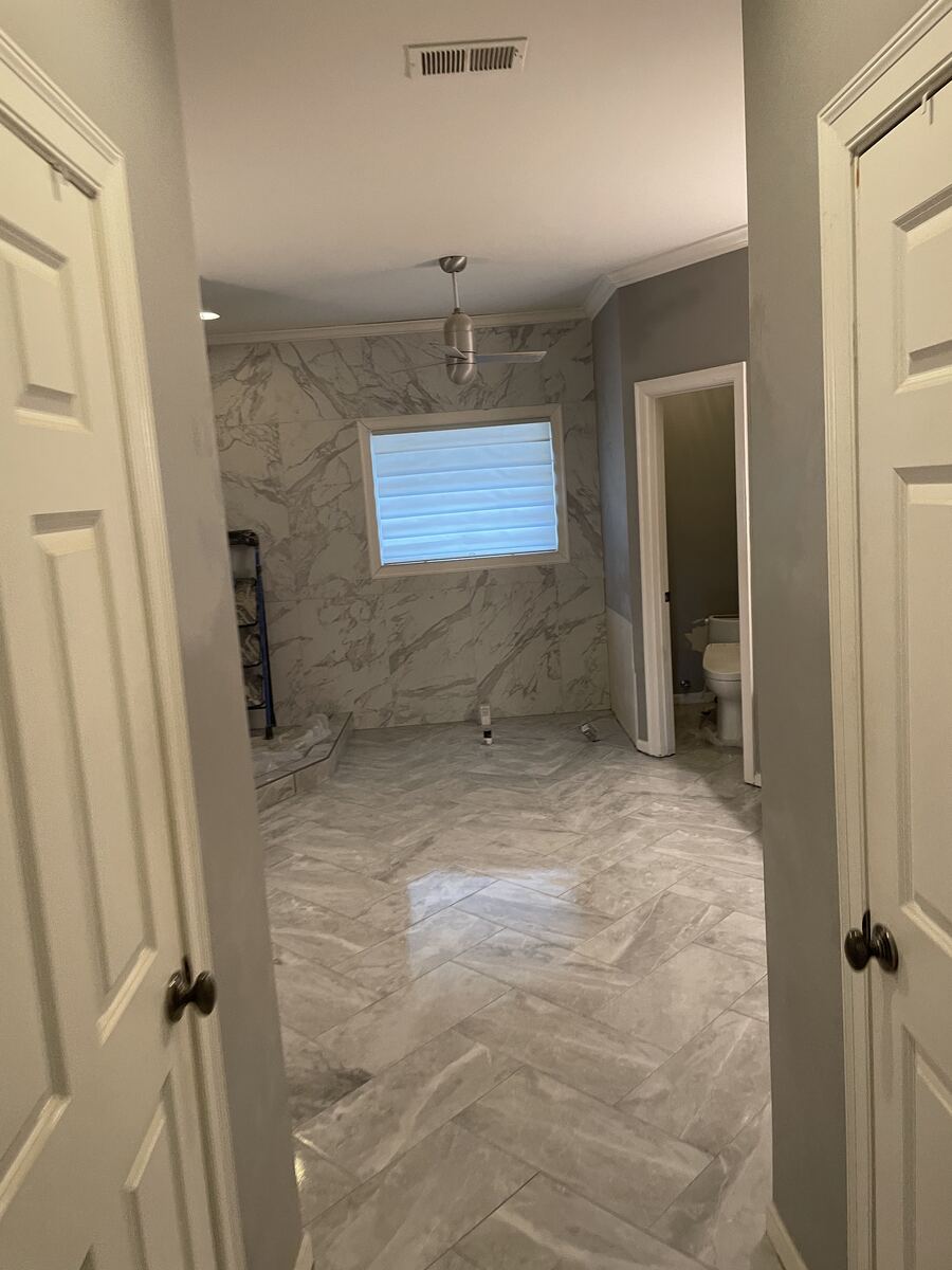 Herringbone tile bathroom floor